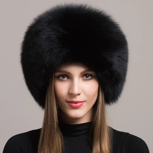 Black natural fox fur hat on a model, showcasing its plush texture and stylish design.