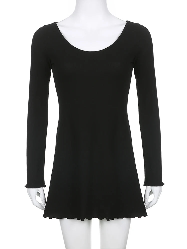 a mannequin wearing a black top with long sleeves