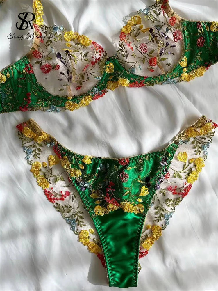 two pieces of green and yellow lingerie on a white sheet