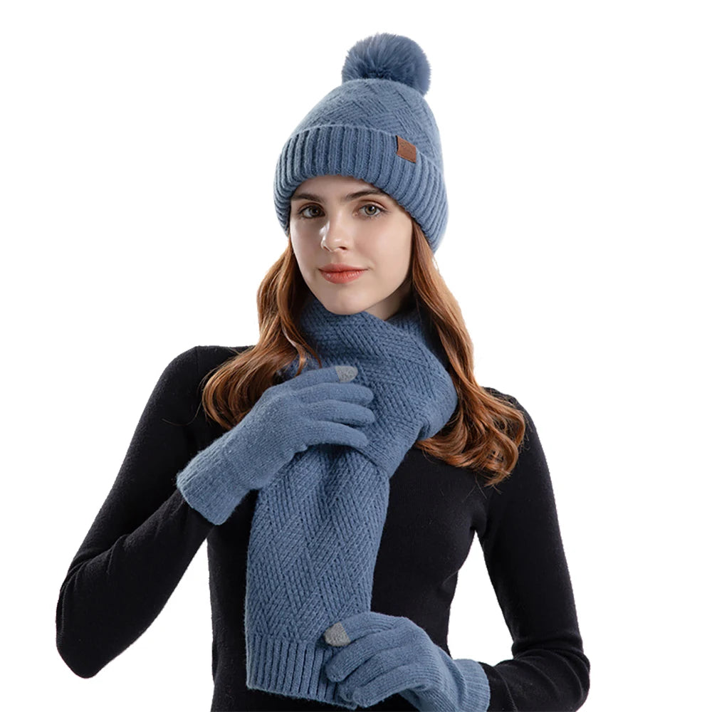 a woman wearing a blue hat and scarf