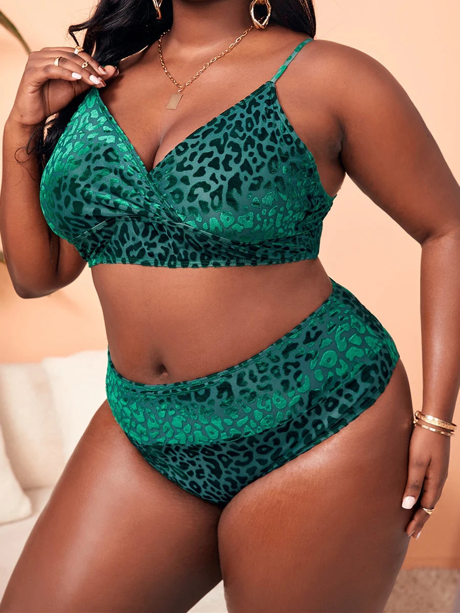a woman in a green leopard print bikinisuit