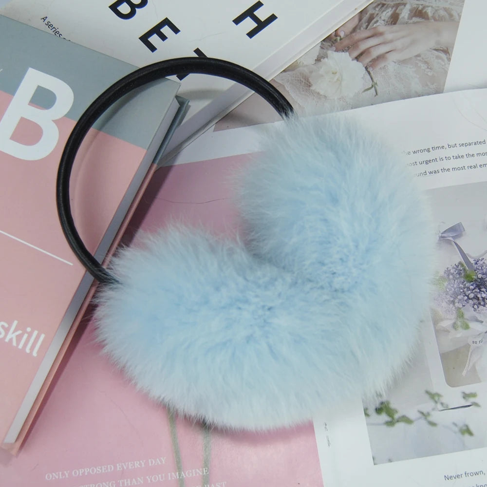 a pair of sheary ear muffs sitting on top of a magazine