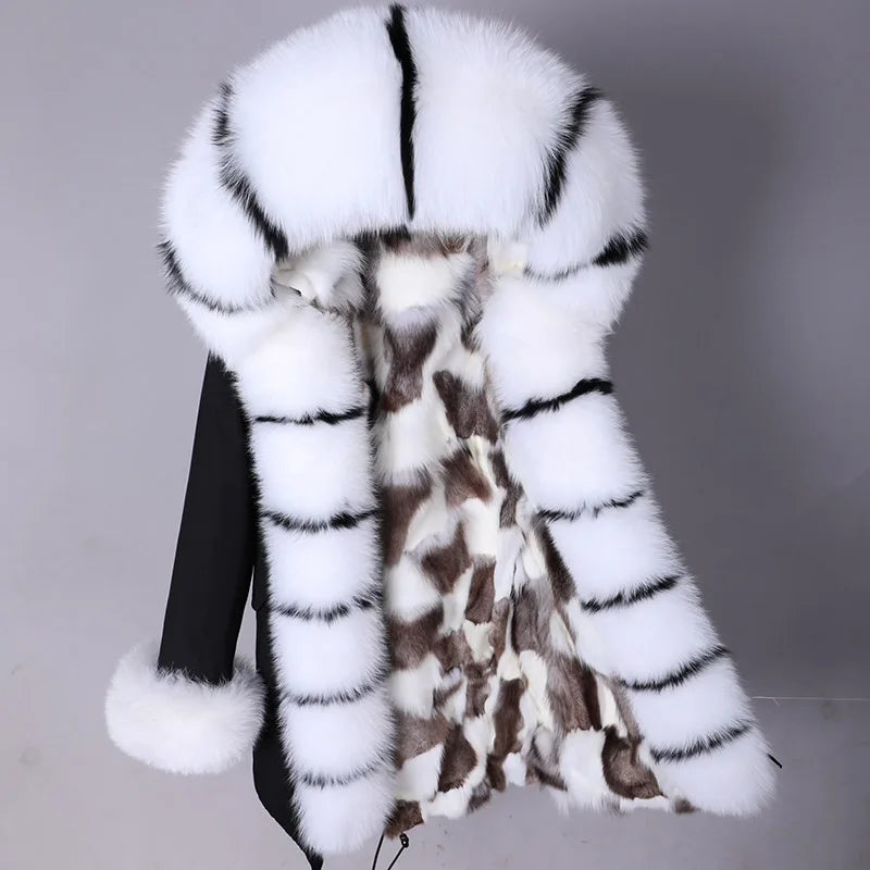 a woman's white and brown fur coat