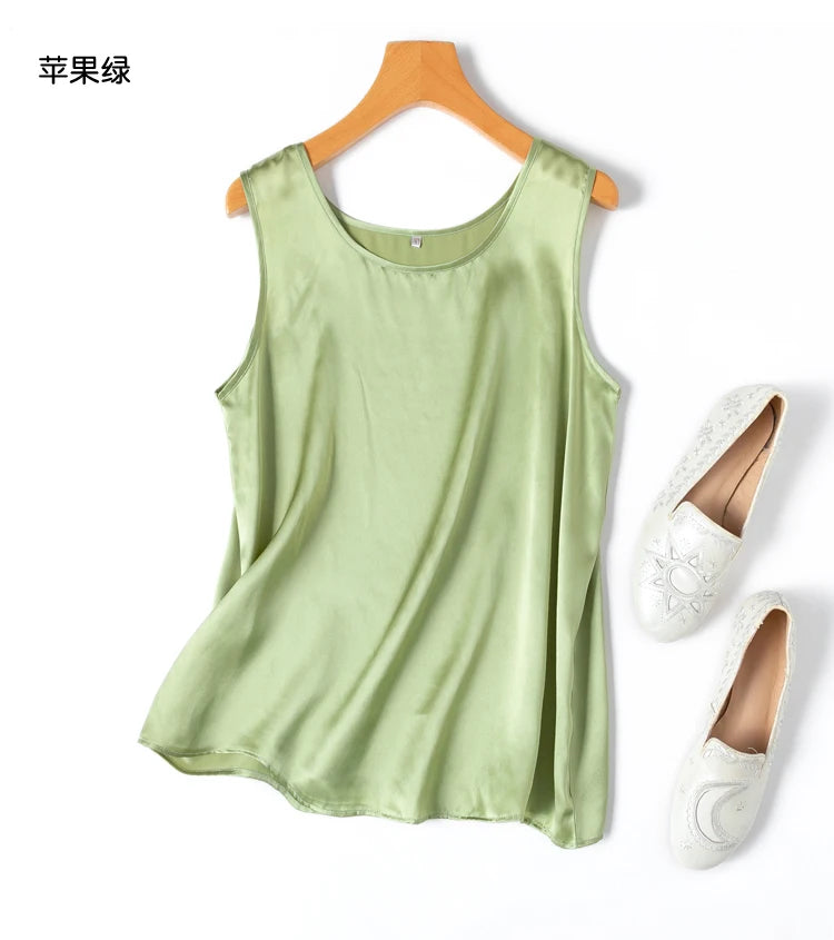 a pair of white shoes and a green tank top