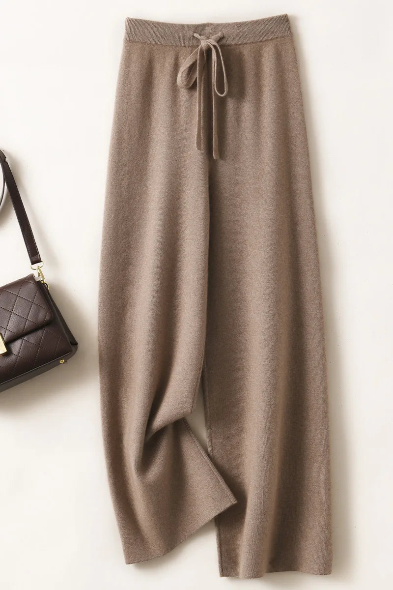 a woman's pants with a purse next to it