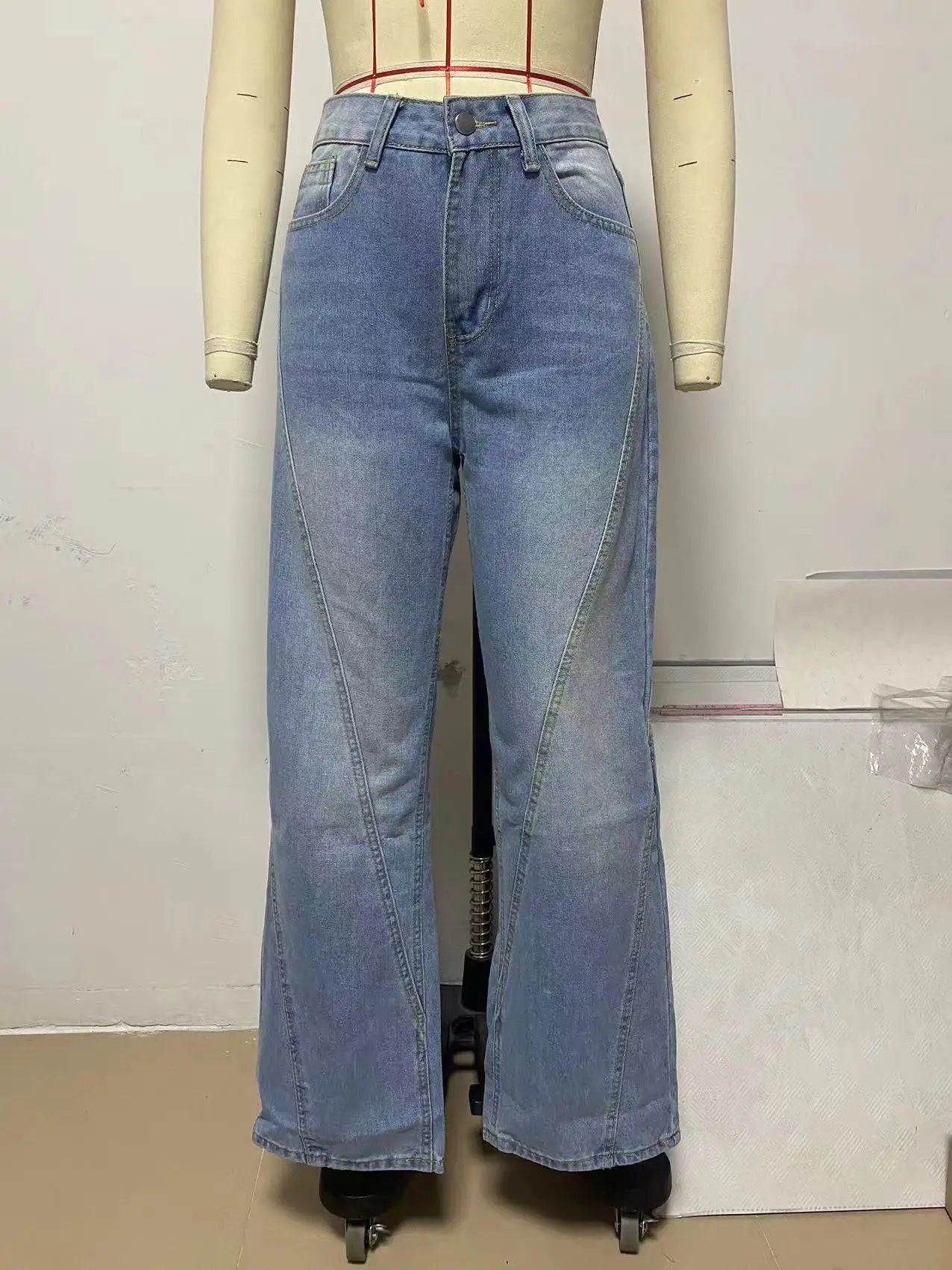 a mannequin wearing a pair of blue jeans