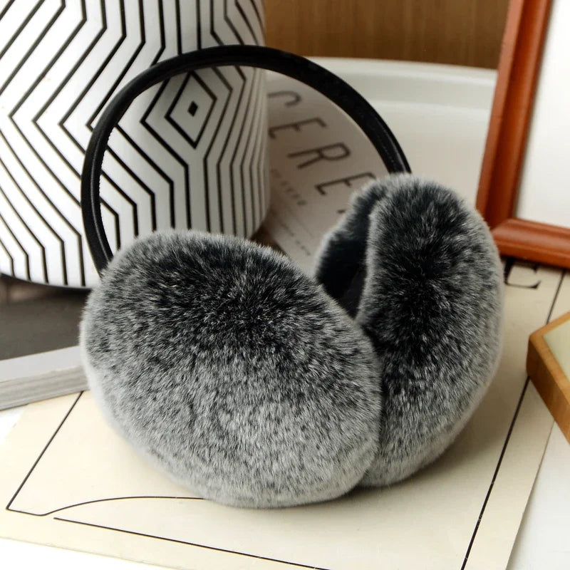 a pair of furry slippers sitting on top of a table