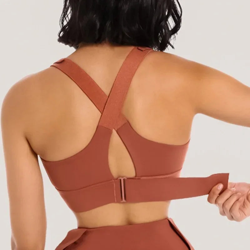 the back of a woman wearing a brown sports bra