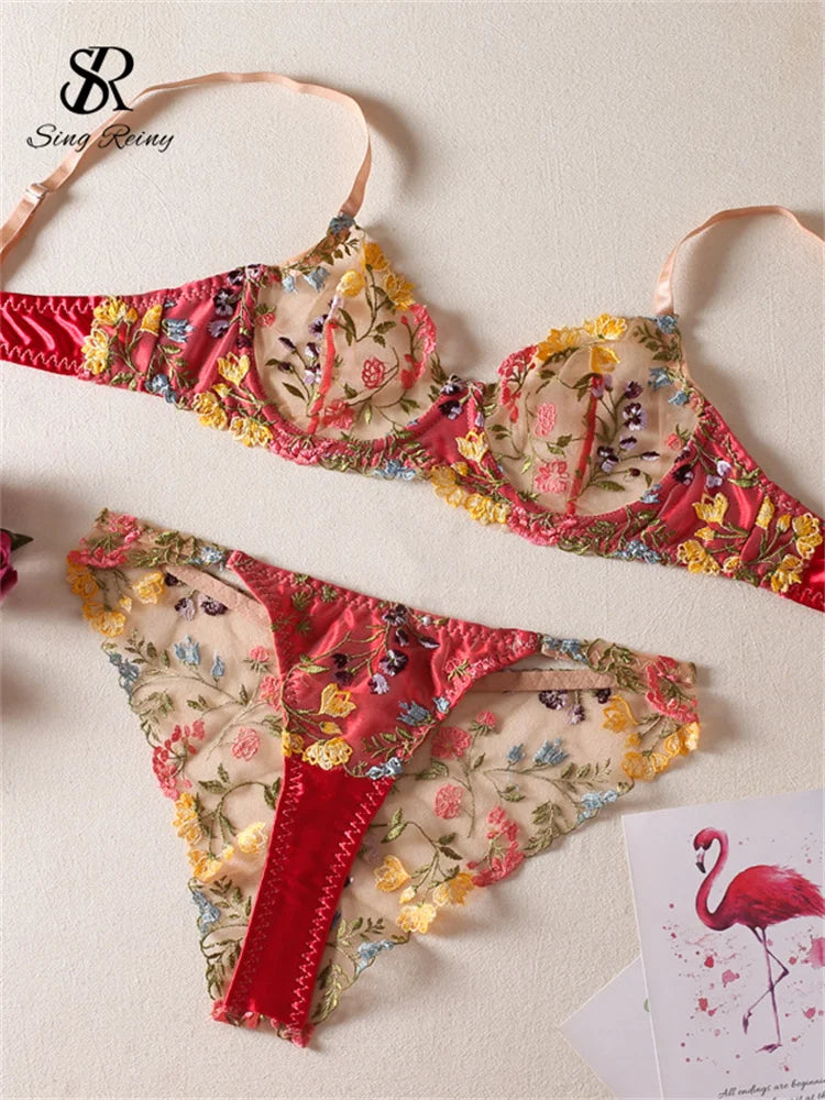 a pair of bikinis with a flamingo print on them