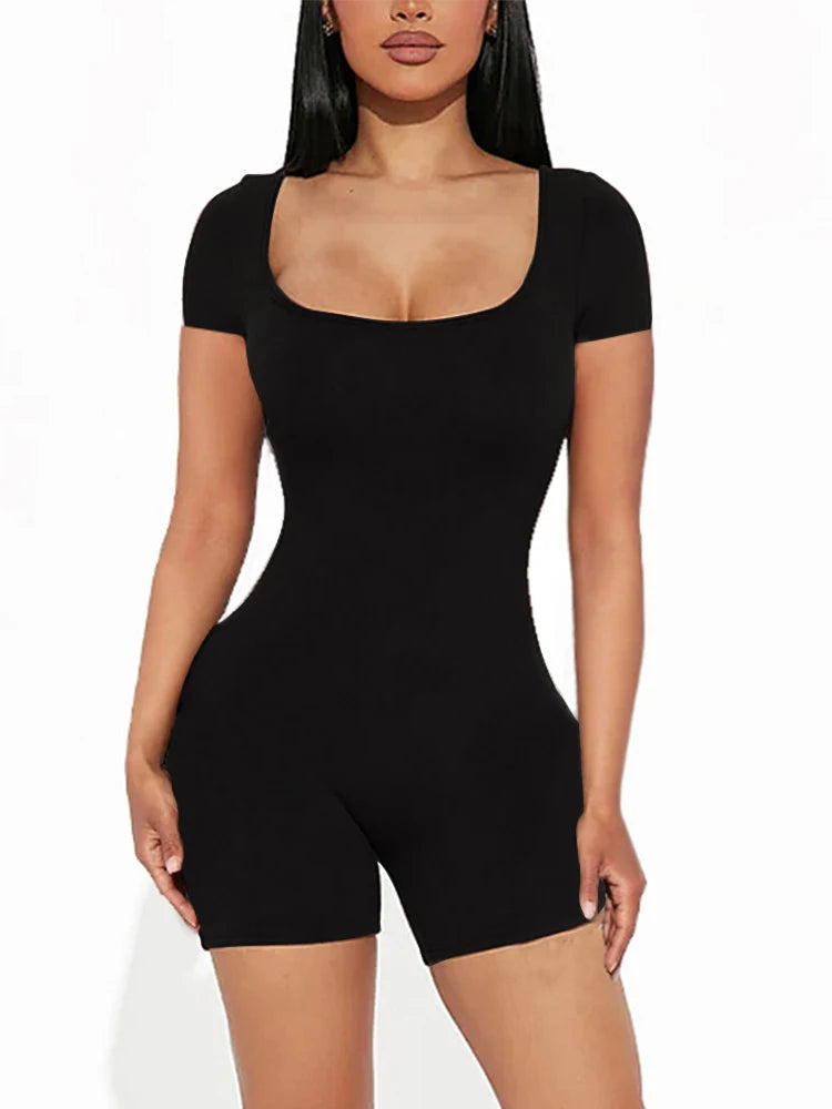 a woman in a short black bodysuit