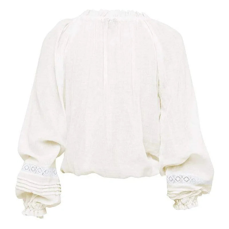 a white blouse with ruffled sleeves
