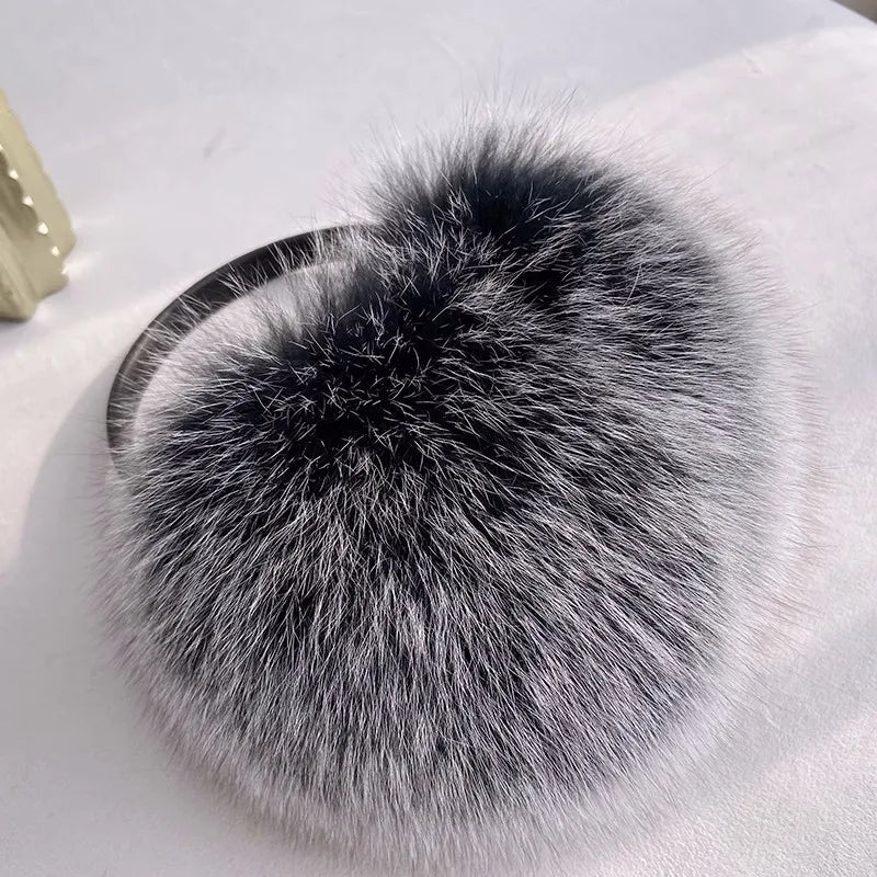 a fur ball sitting on top of a white table