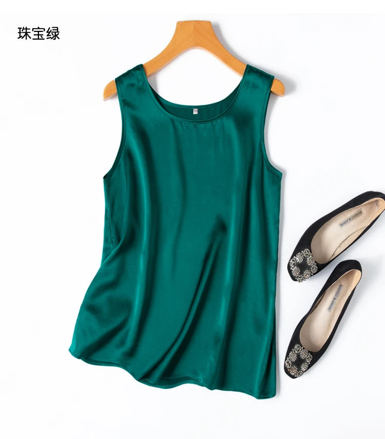 a pair of shoes and a green top on a hanger