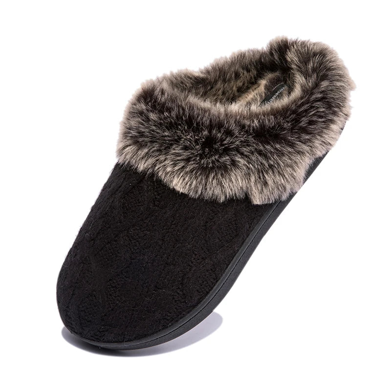 a pair of black slippers with a fur lining