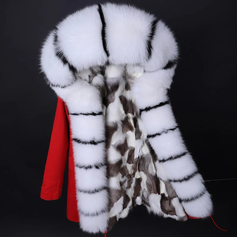 a white and brown fur coat hanging on a rack