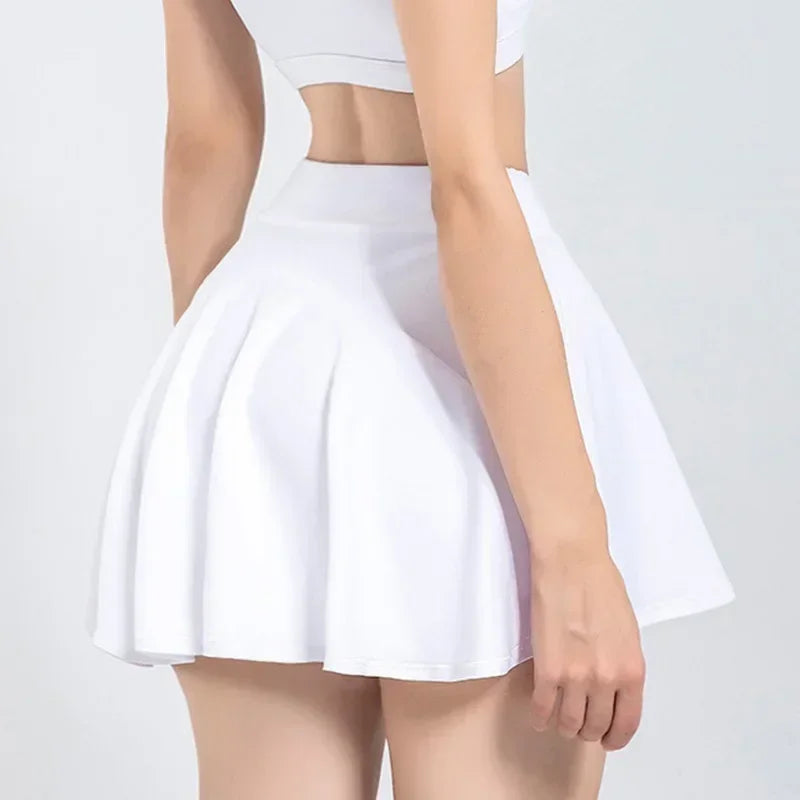 Back view of a woman wearing a white flared tennis skort, highlighting its simple yet stylish look.