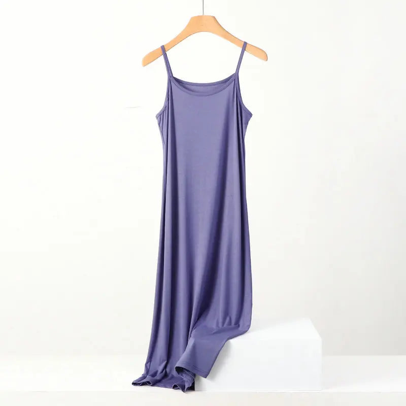 a purple dress hanging on a hanger