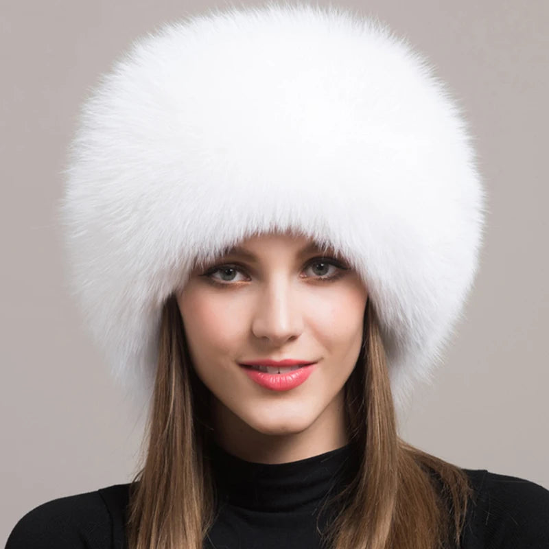 Chic white natural fox fur hat worn by a model, emphasizing a soft and elegant appearance.