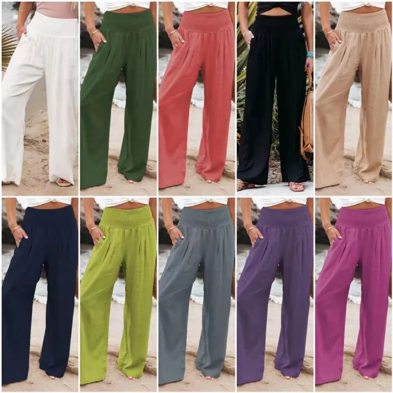 a group of different colored pants with a woman standing in the background