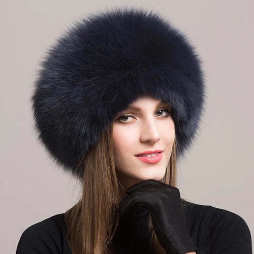 Fashionable navy natural fox fur hat on a model, highlighting its rich color and luxurious feel.