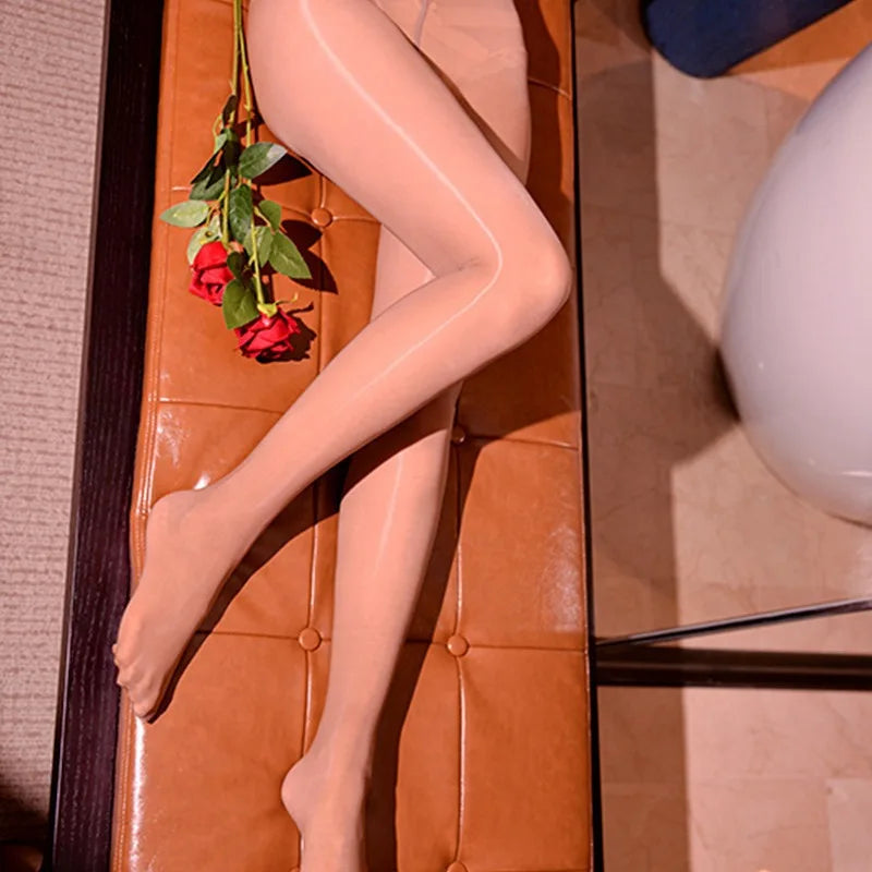 a woman laying on a couch holding a rose