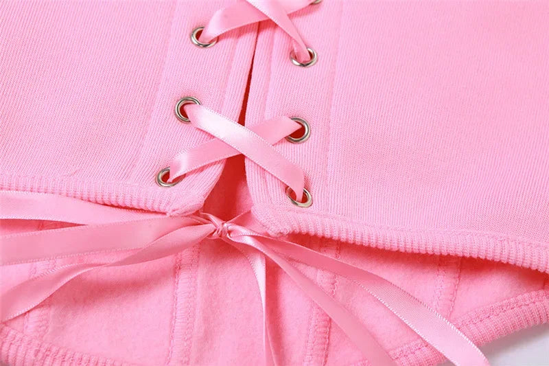 a close up of a pink underwear with a ribbon tied around it