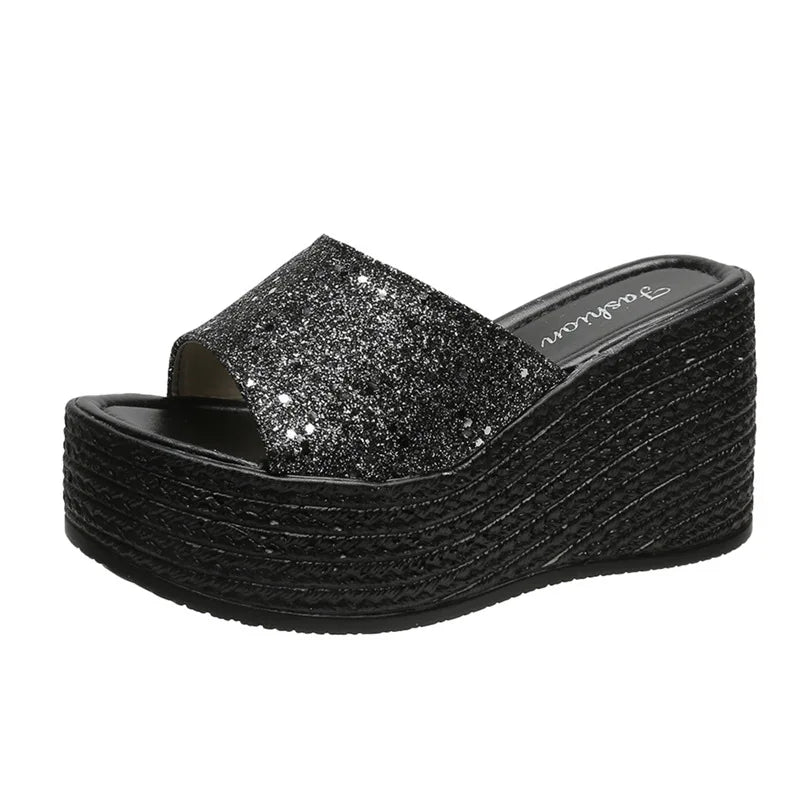 a women's black platform sandal with glitter