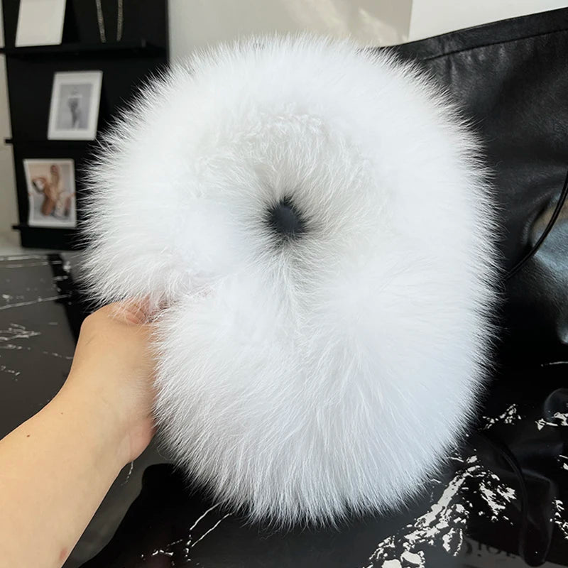 a person is holding a fluffy white object