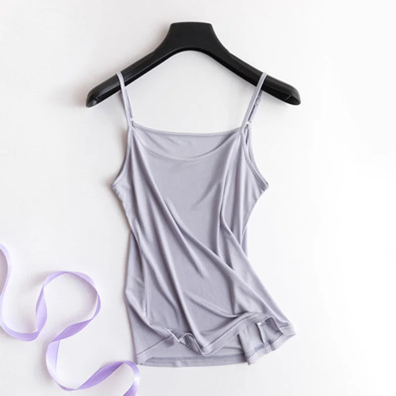 a woman's gray tank top and a purple ribbon