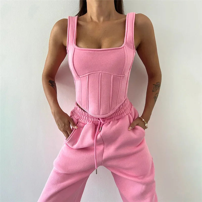 a woman in a pink outfit posing for a picture