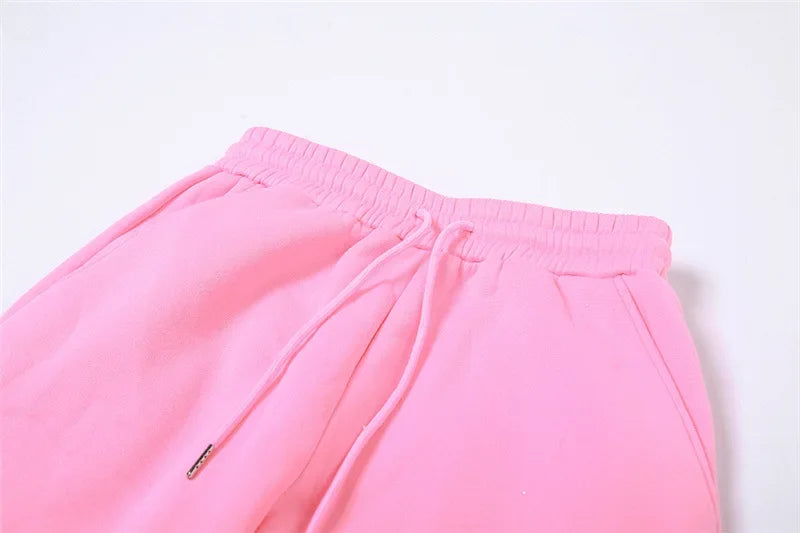 a close up of a pink pants on a white background