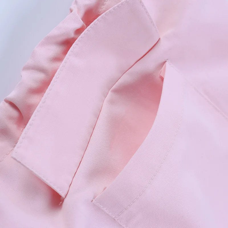 a close up of a pink shirt on a white background