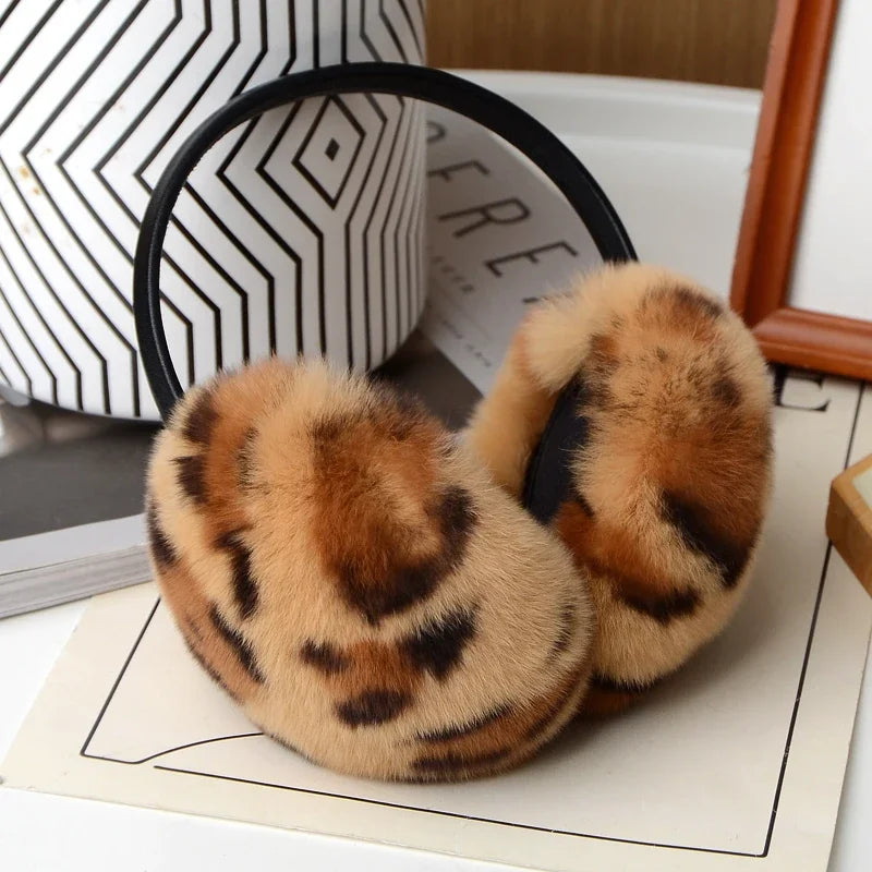 a pair of animal print slippers sitting on top of a table