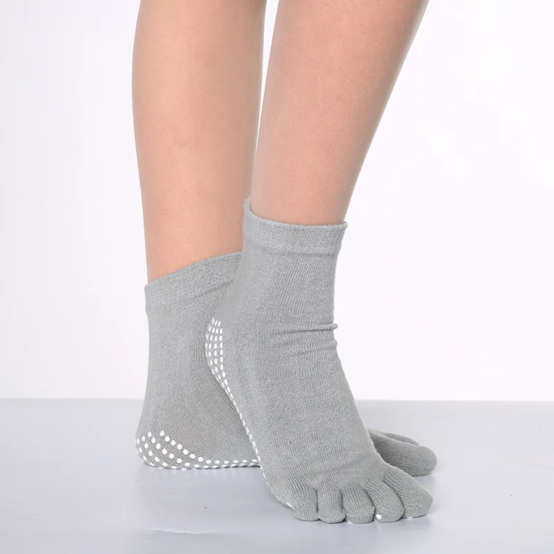 a woman's feet wearing a pair of gray socks