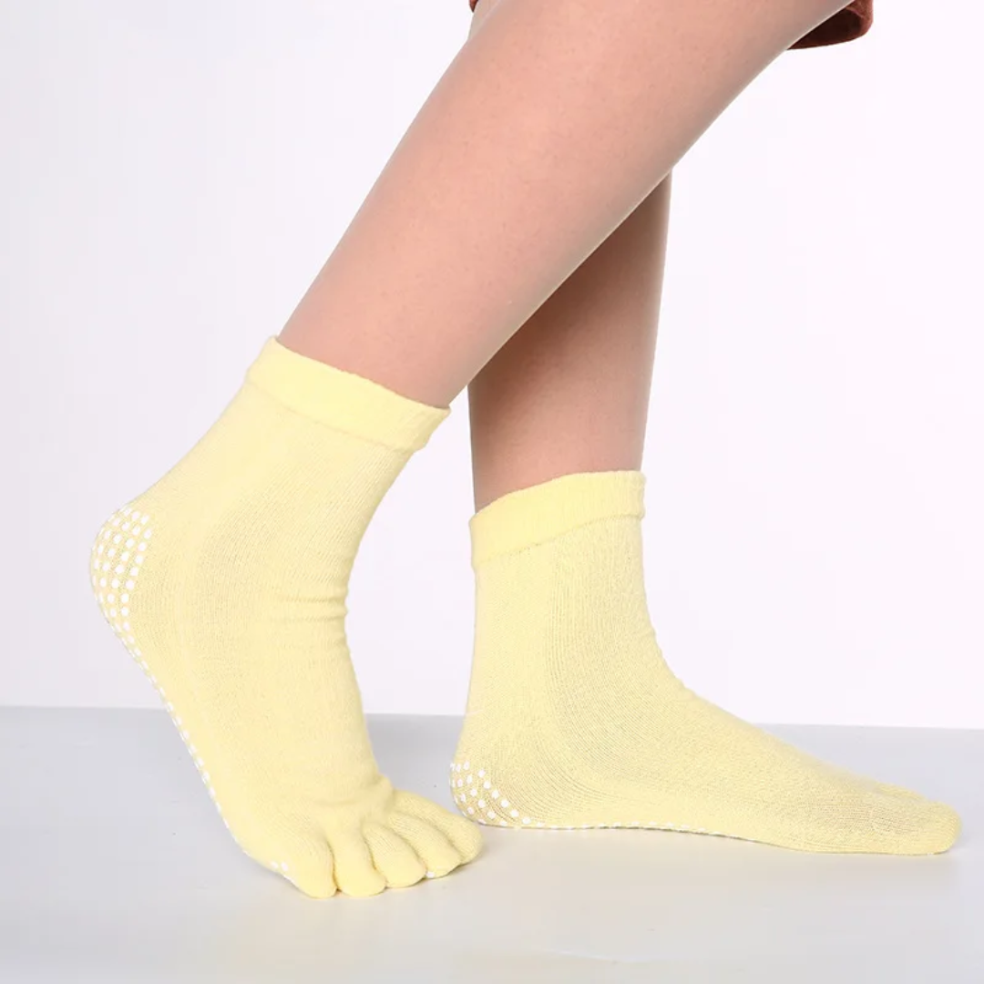 a woman's legs with a pair of yellow socks