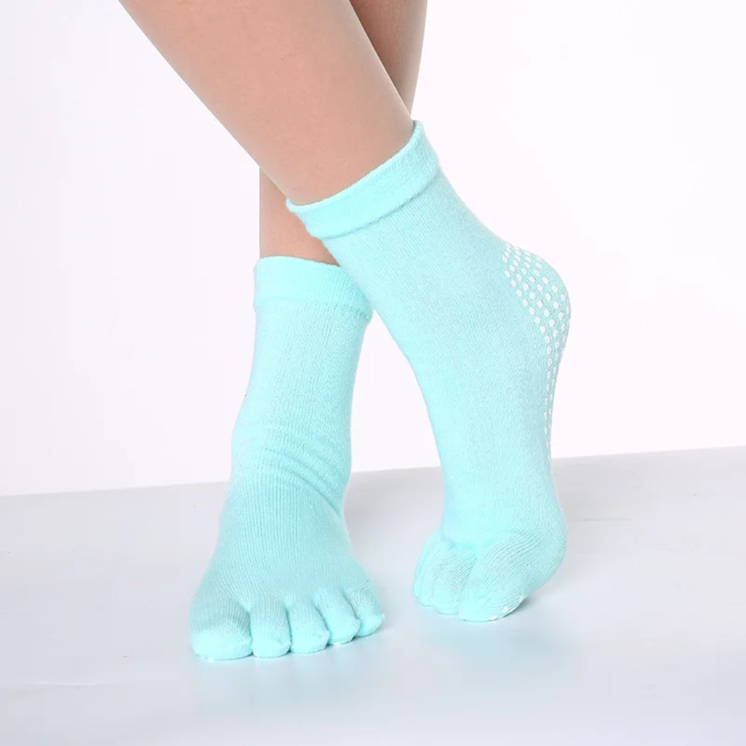 a woman's legs with a pair of blue socks