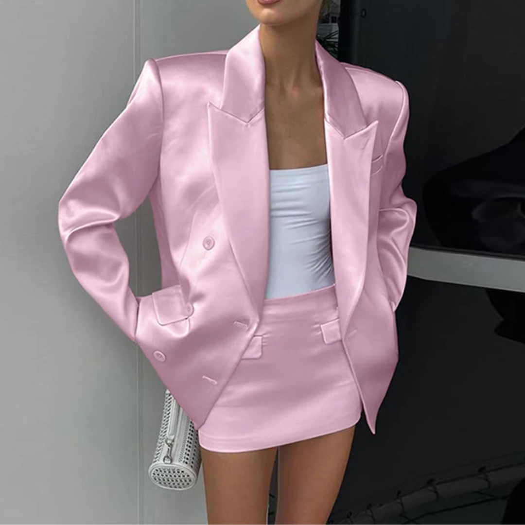 a woman in a short skirt and a pink jacket