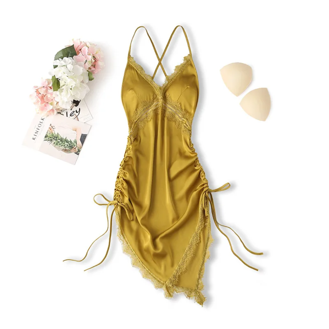 a women's yellow lingerie and a flower on a white background