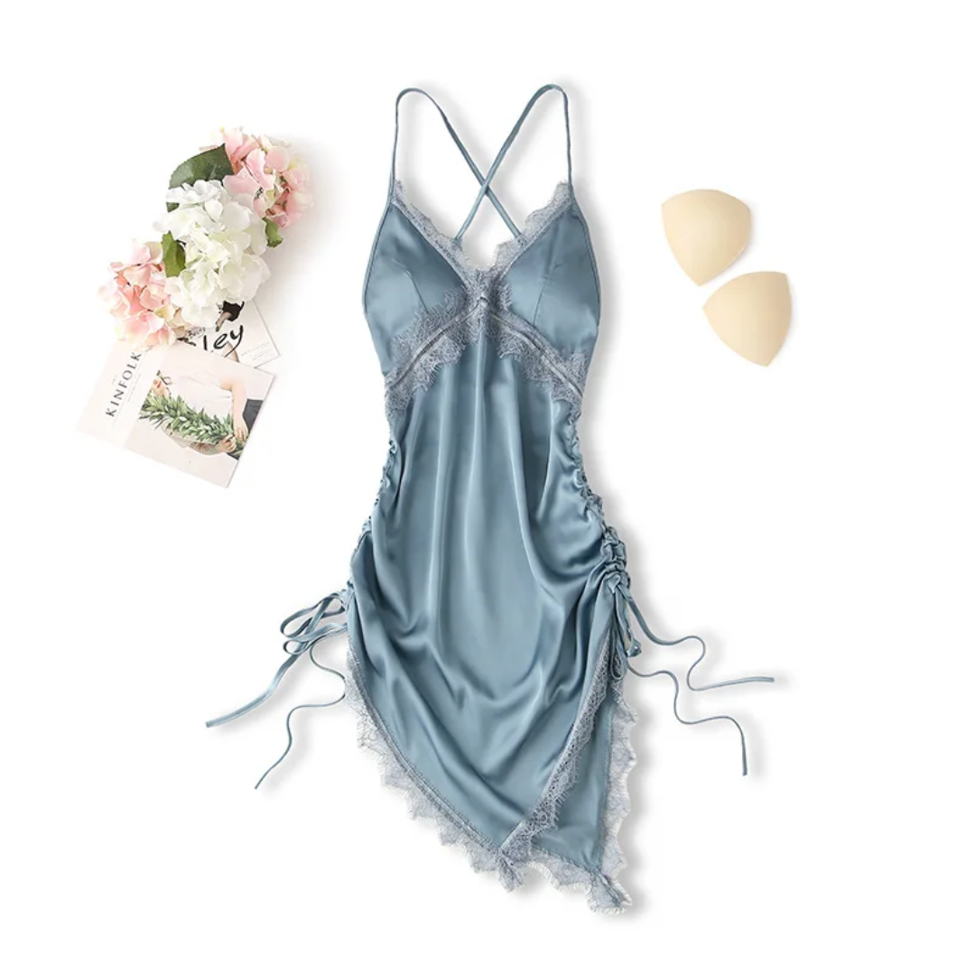 a women's blue lingerie and a flower on a white background