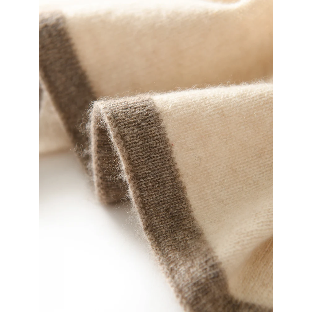 a close up of a white and brown blanket