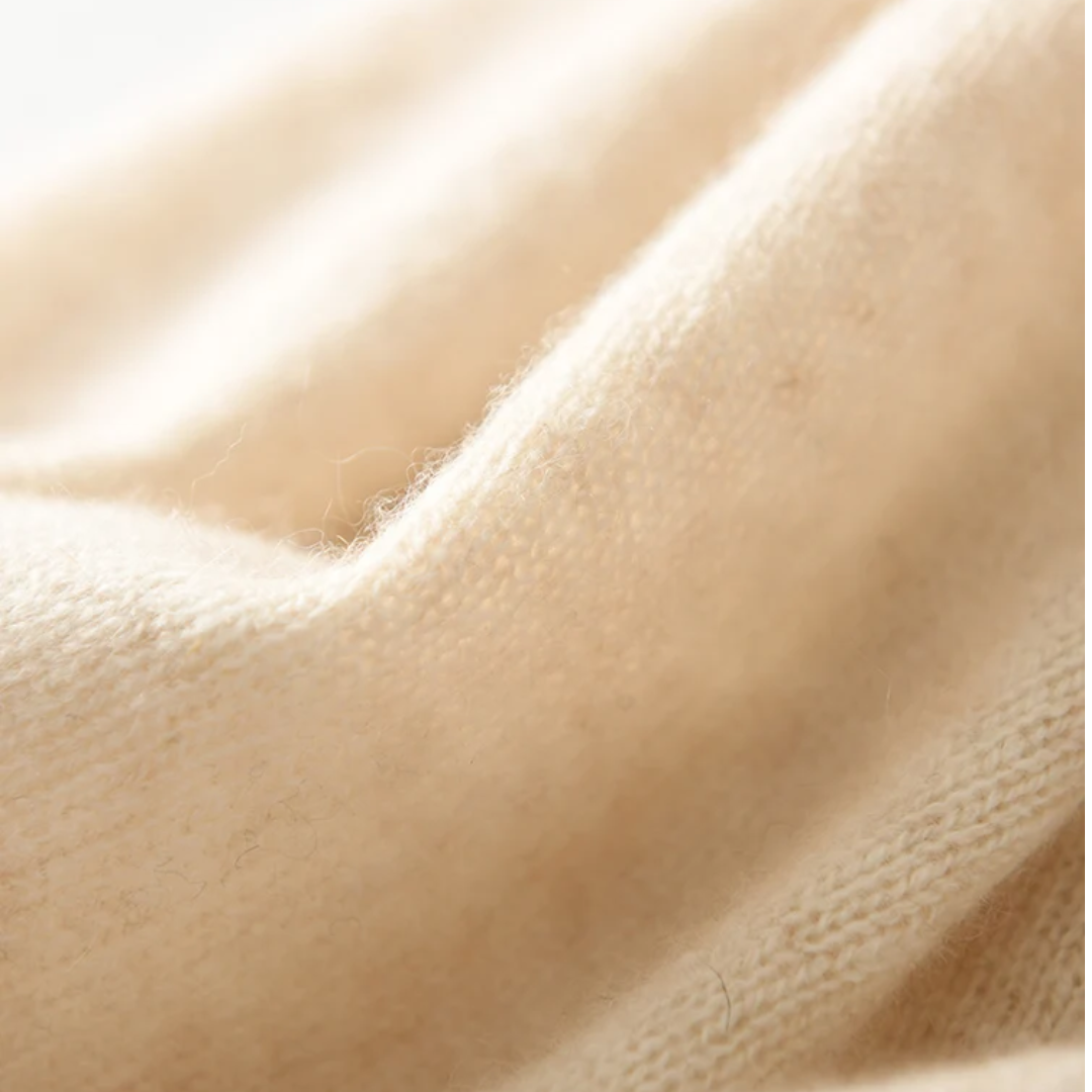 a close up of a white fabric with a white background