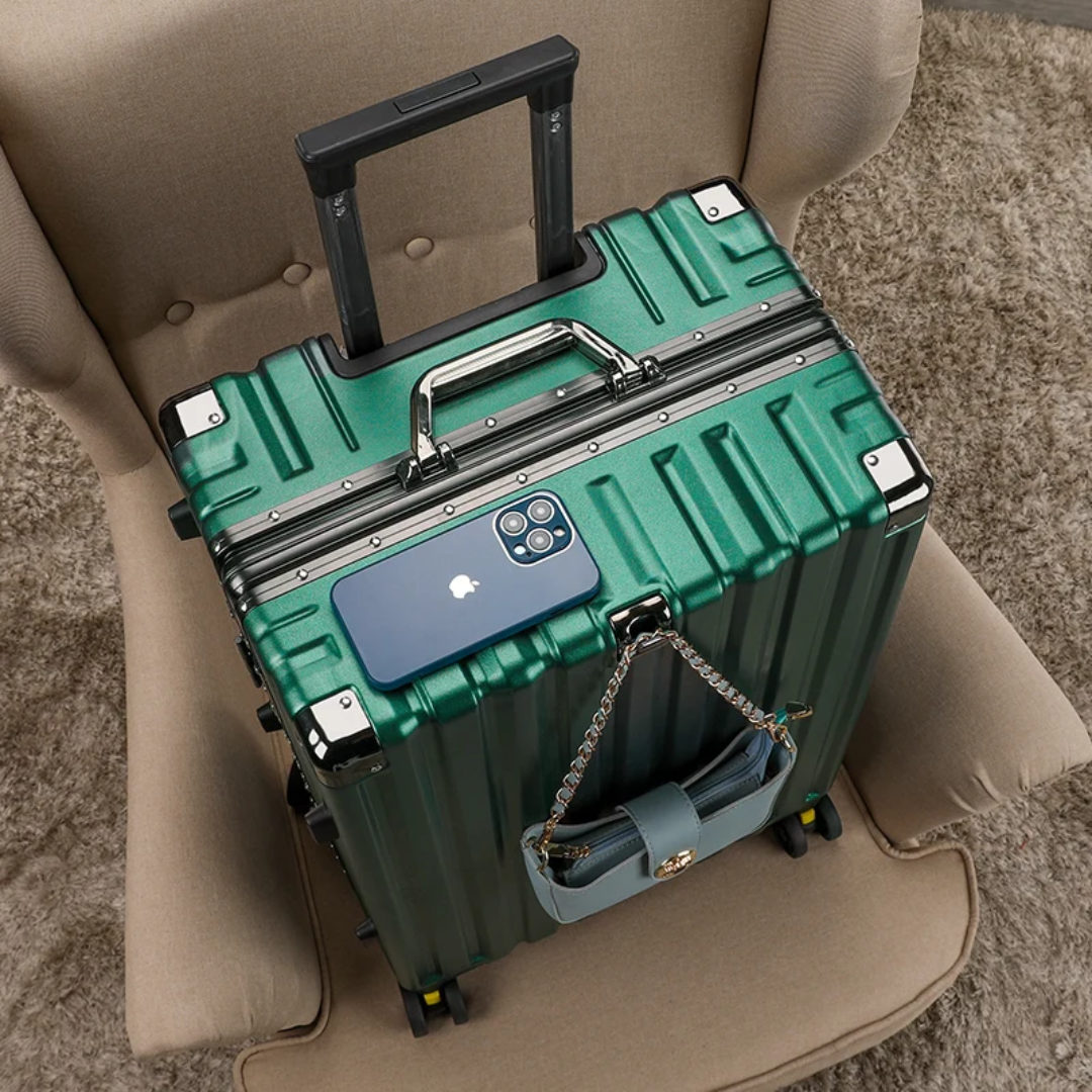 a green suitcase sitting on top of a chair
