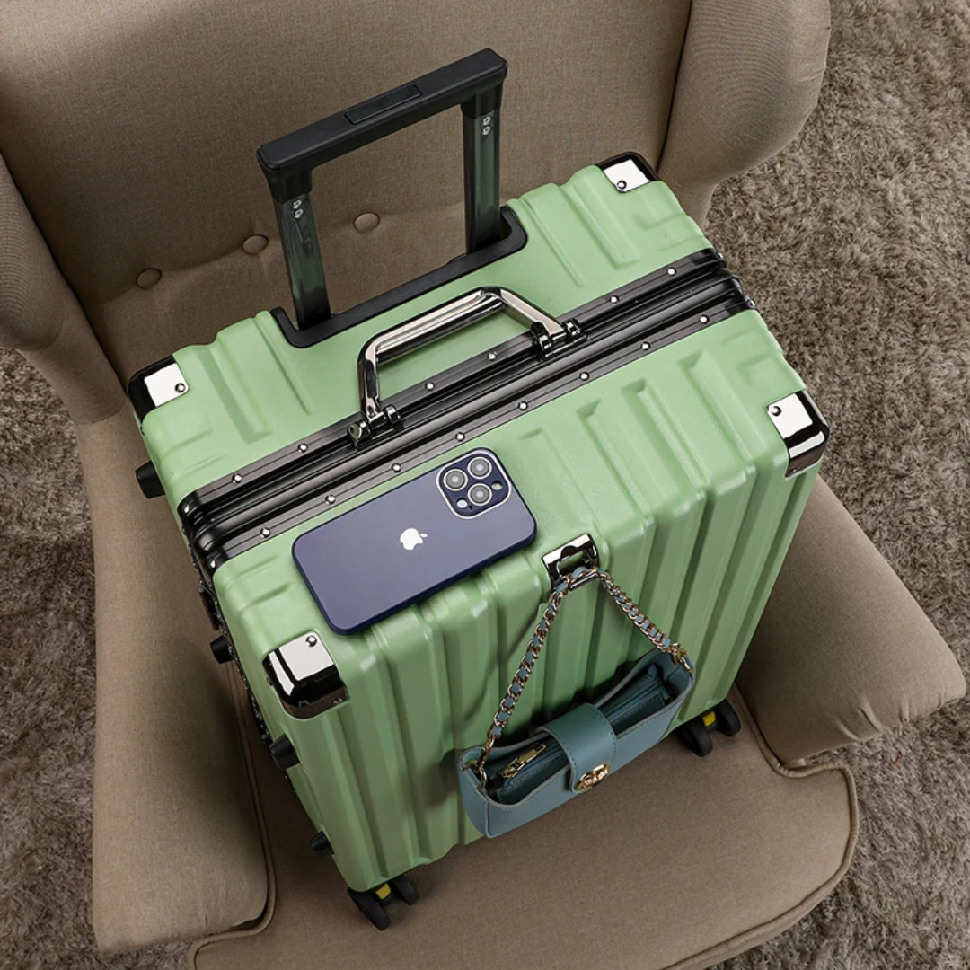 a green piece of luggage sitting on top of a chair