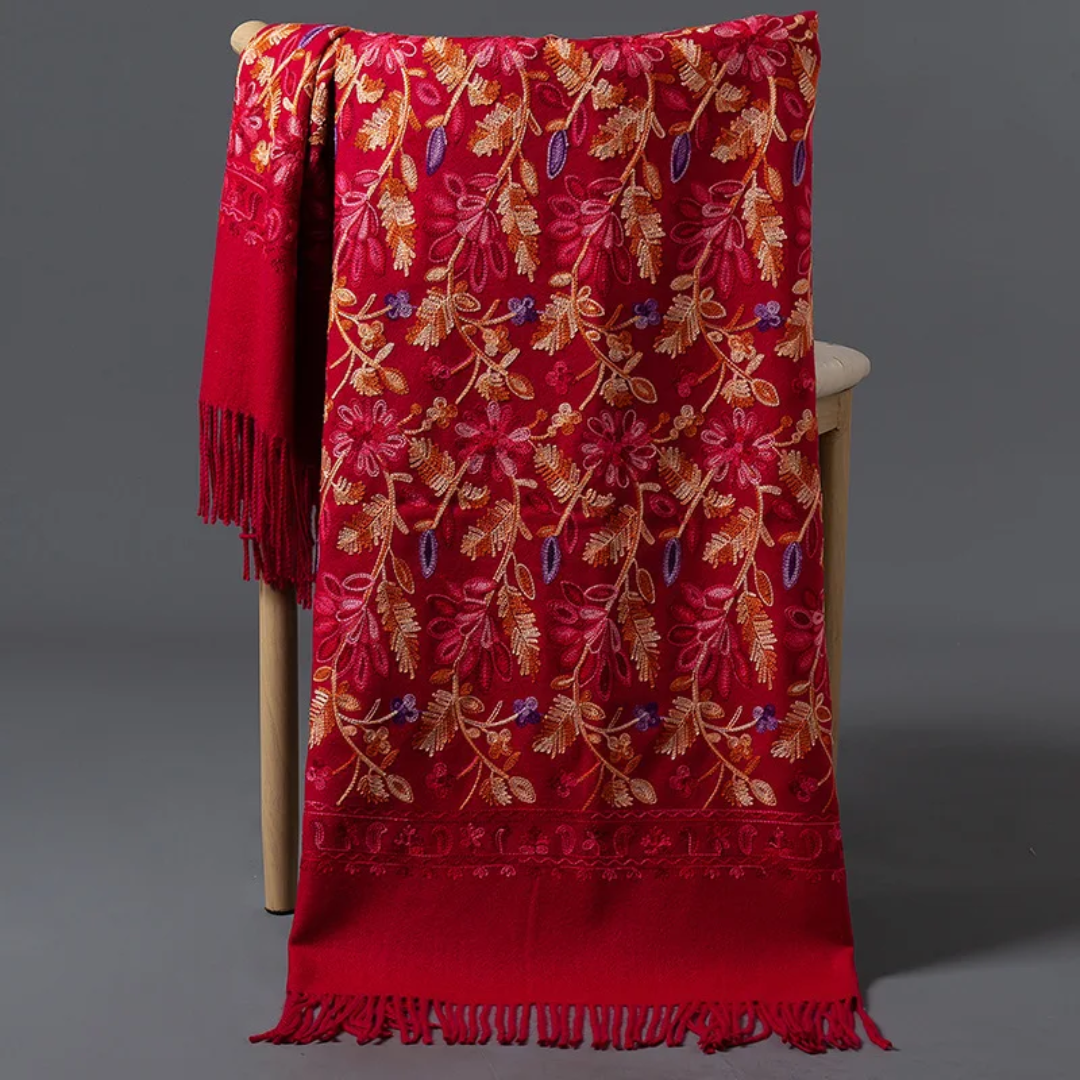 a chair with a red blanket on top of it