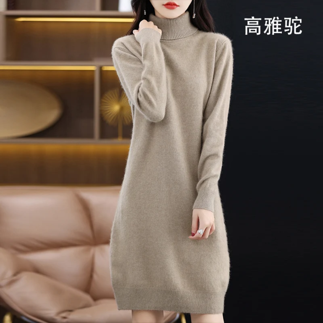 a woman standing in a room wearing a sweater dress