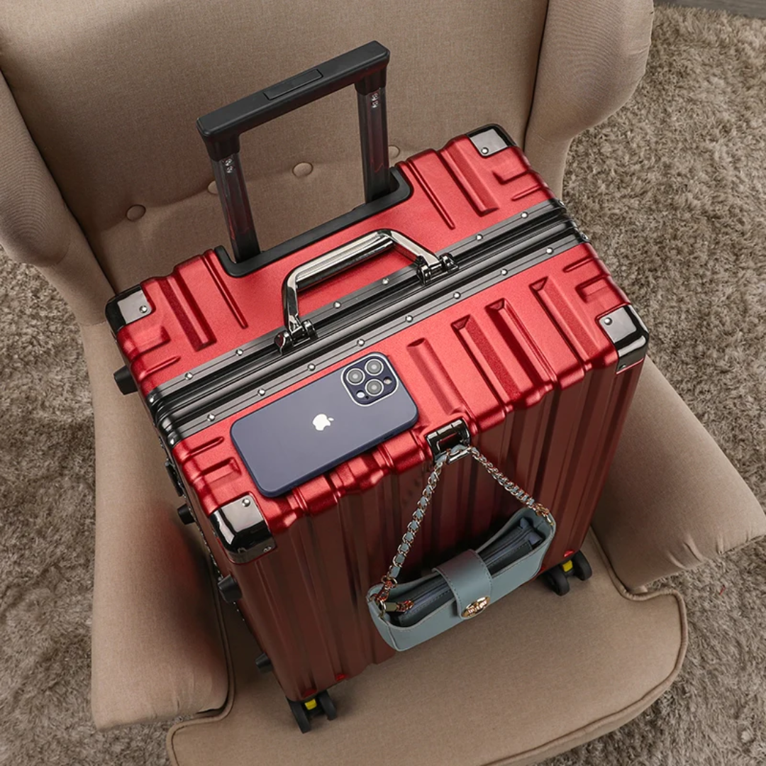 a red suitcase sitting on top of a chair