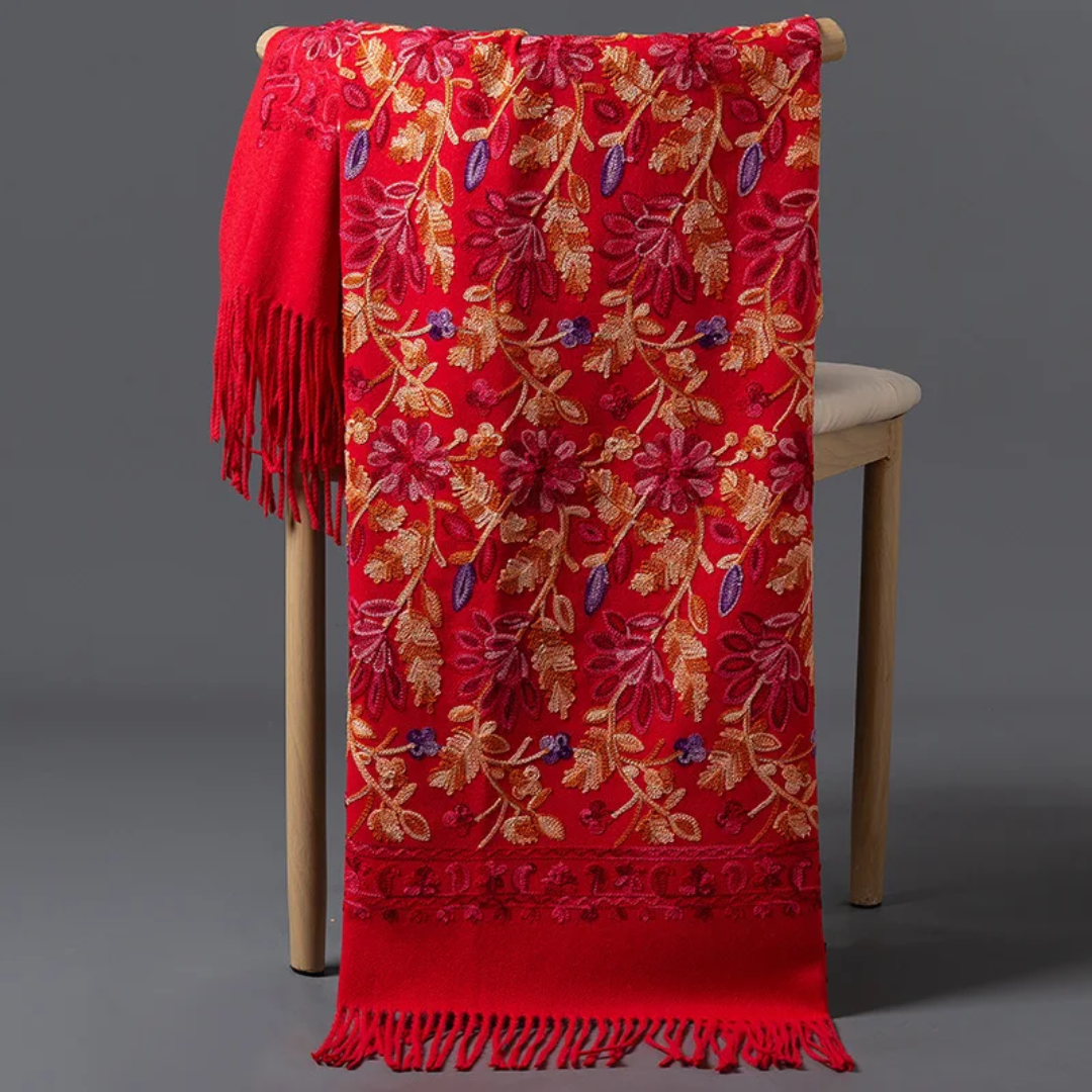a chair with a red blanket on top of it