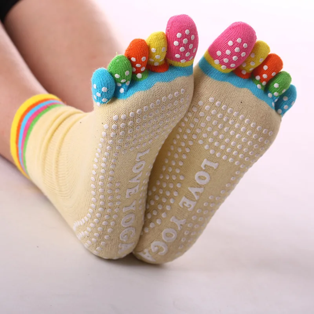 a pair of feet with colorful socks on