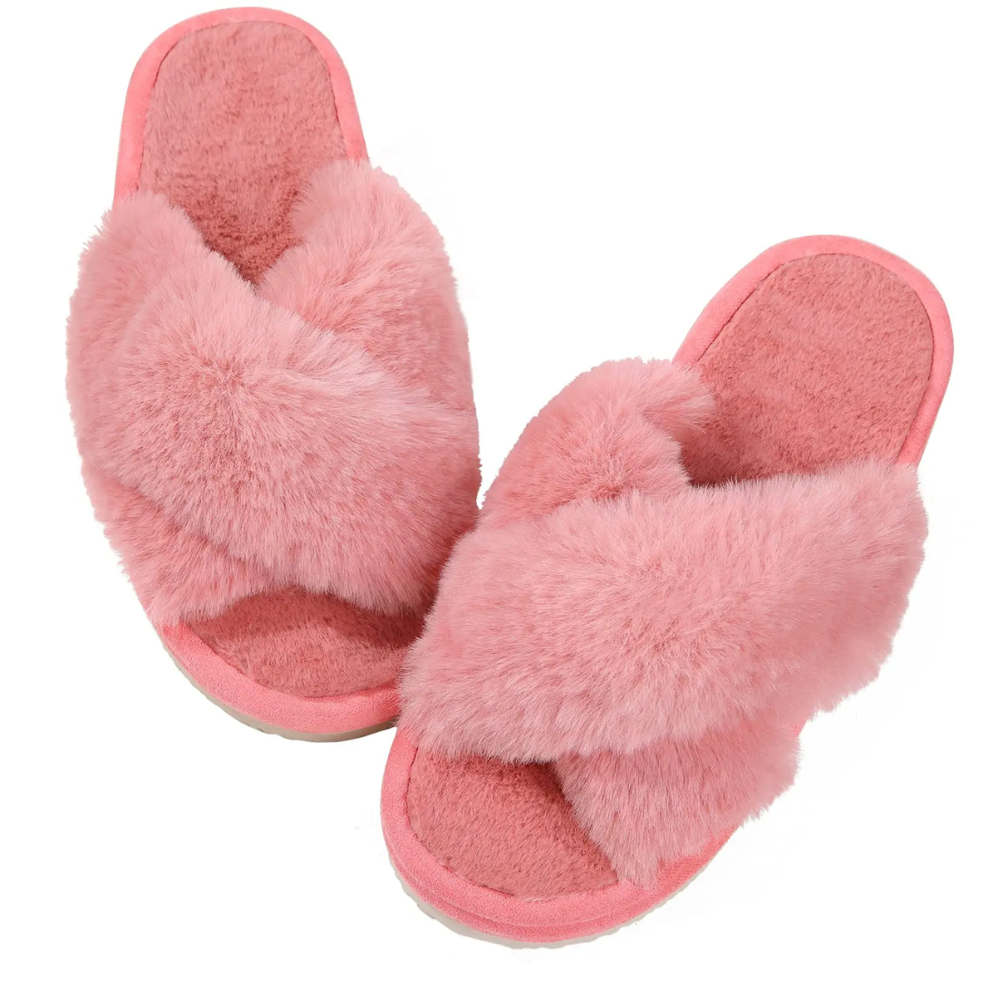 a pair of pink slippers on a white background