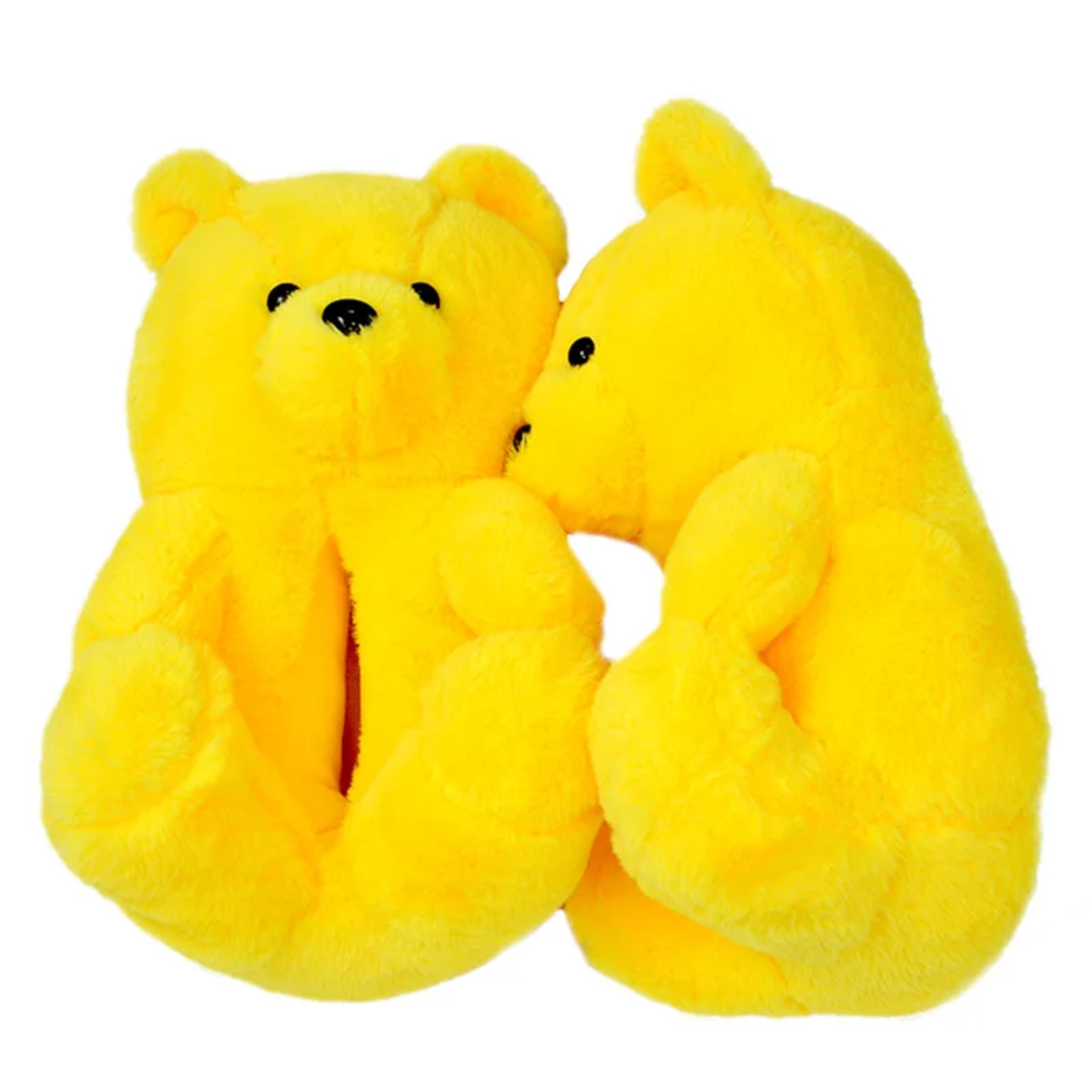 a pair of yellow teddy bears sitting next to each other